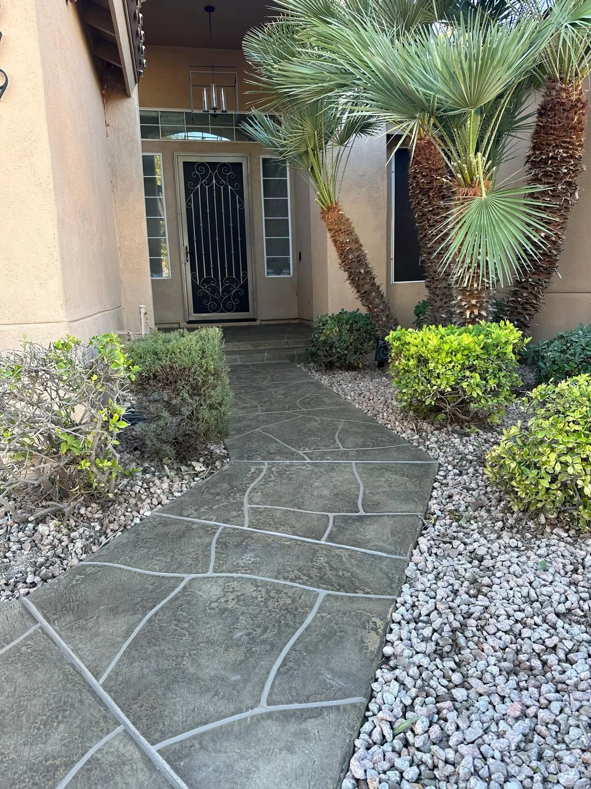 Acrylic stamped concrete pool deck with decorative stone pattern design