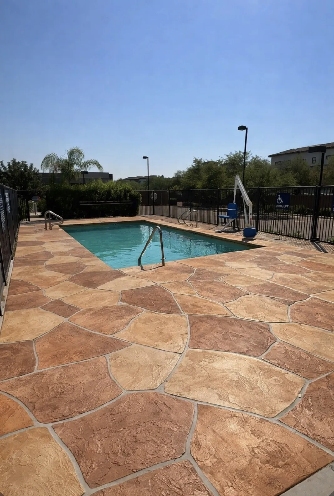 Decorative acrylic stamped pool deck resurfacing with tile pattern Arizona