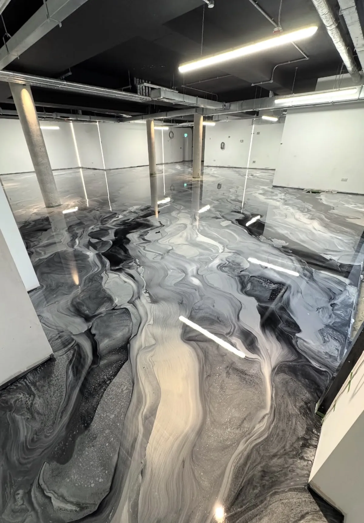 Industrial strength metallic epoxy floor coating marble swirl finish